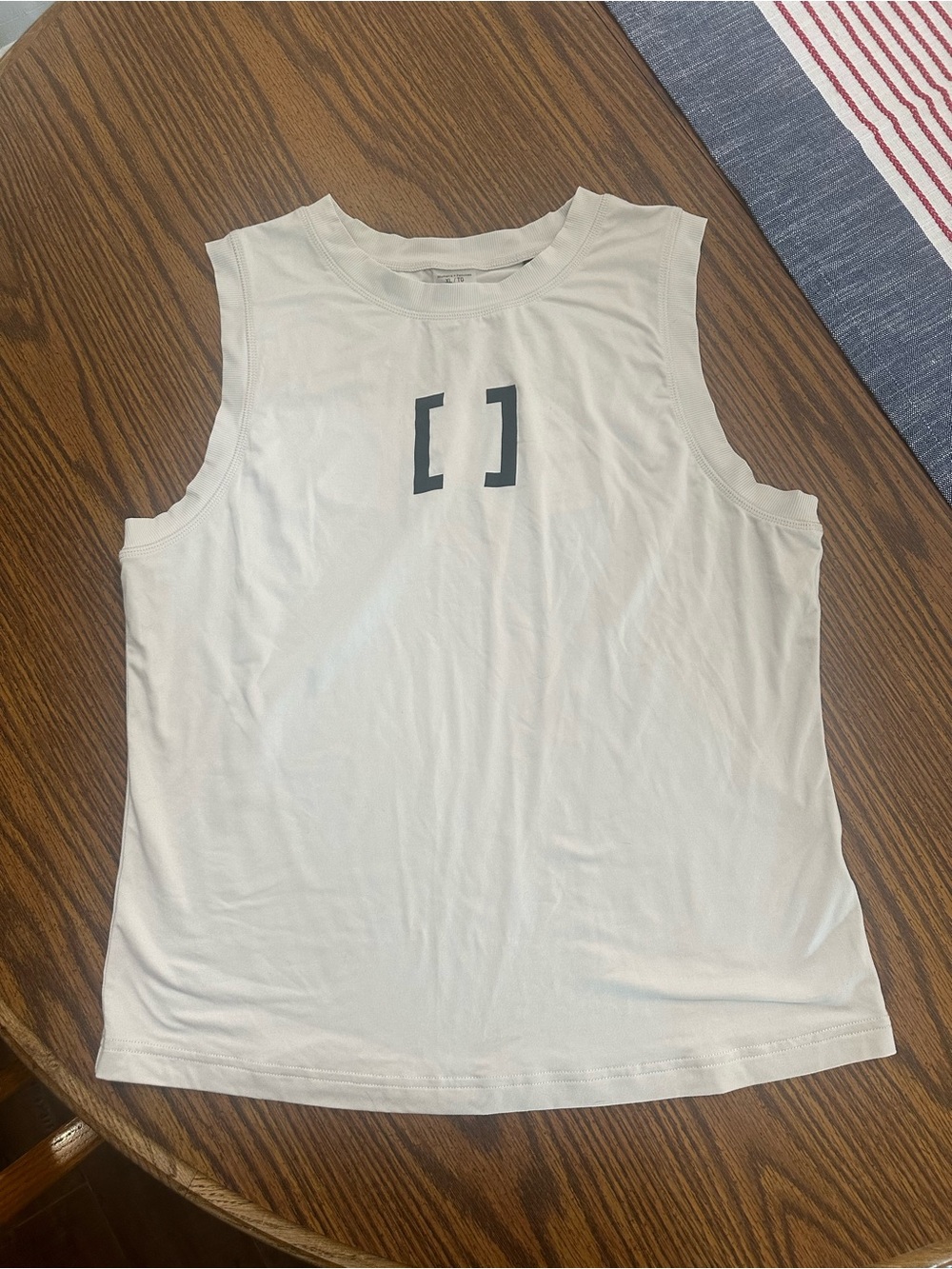 Cream/Sand [solidcore] sleeveless workout tank with bracket logo!